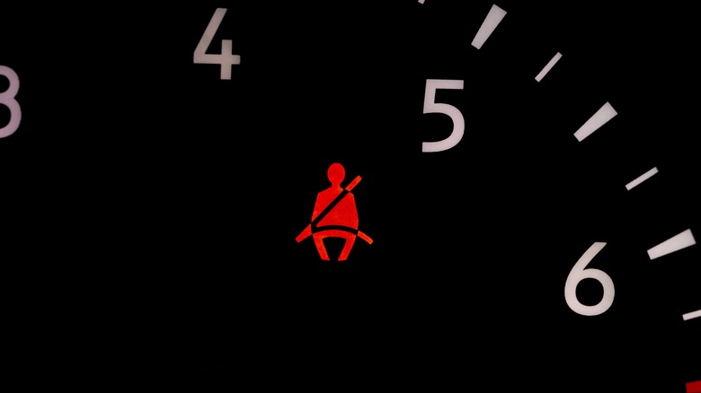 Seat belt warning light flashing