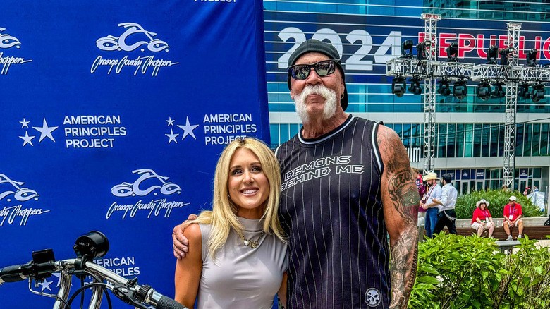 Riley Gaines and Paul Teutul Sr.  standing outside Republican National Convention