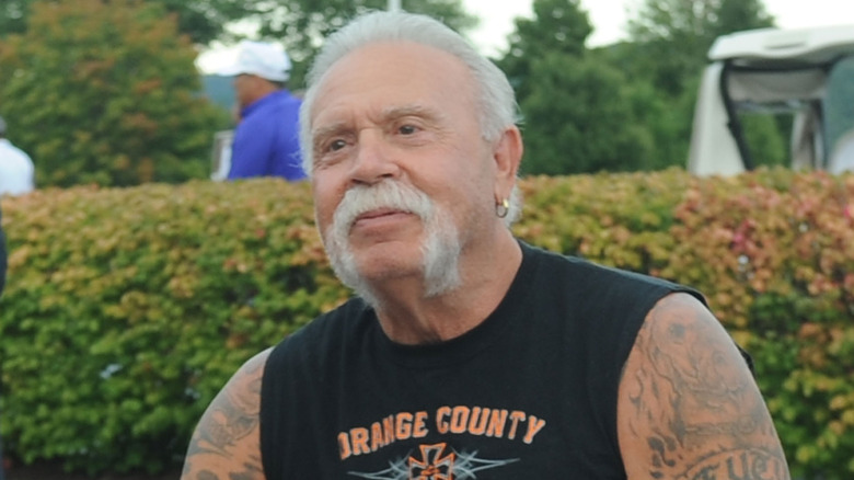 Paul Teutul sitting on a motorcycle