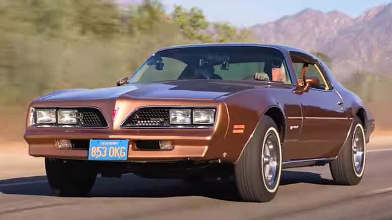 Front three-quarter view of the "Rockford Files" Pontiac Firebird on a road