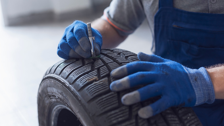 person fixing tire