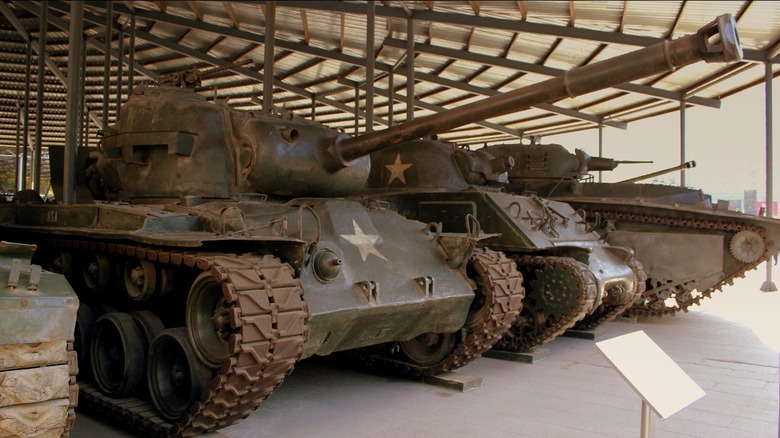 An M26 Pershing parked beside a variant of the M4 Sherman