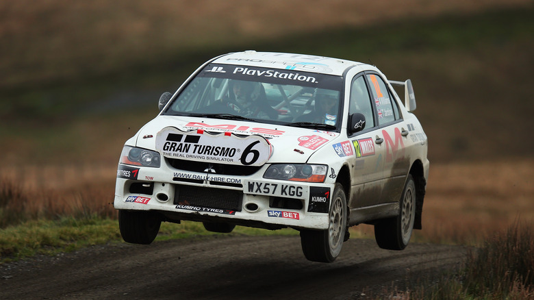 Mitsubishi Lancer Evolution IX rally car jumping