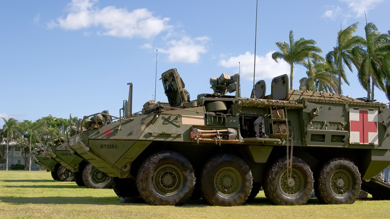 Army Strykers parked on grass