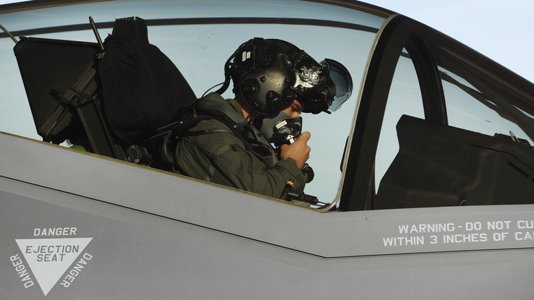 F-35 pilot doing pre-flight checks in the cockpit