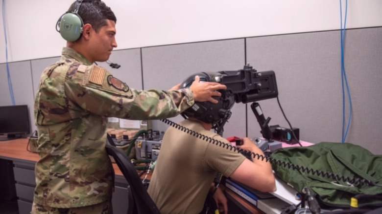 USAF personnel fitting F-35 helmet