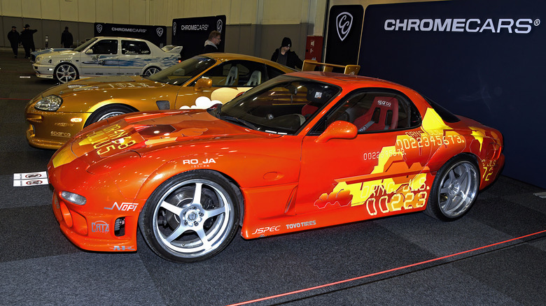 Orange Mazda RX-7 parked