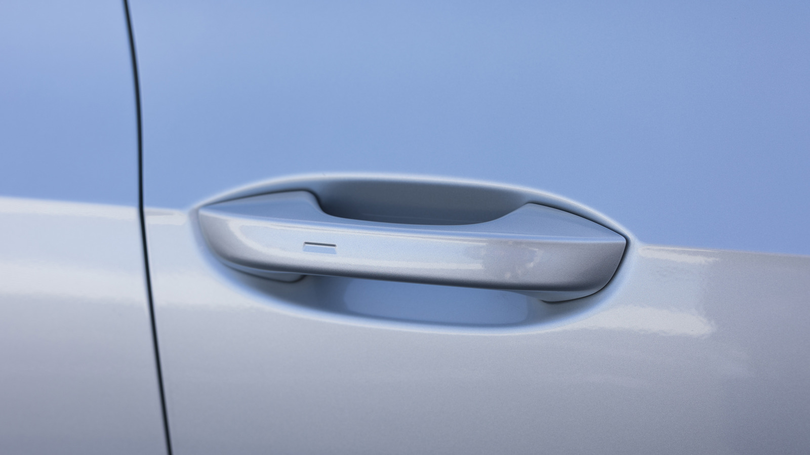 Here's What That Small Button On Your Car Door Handle Is For