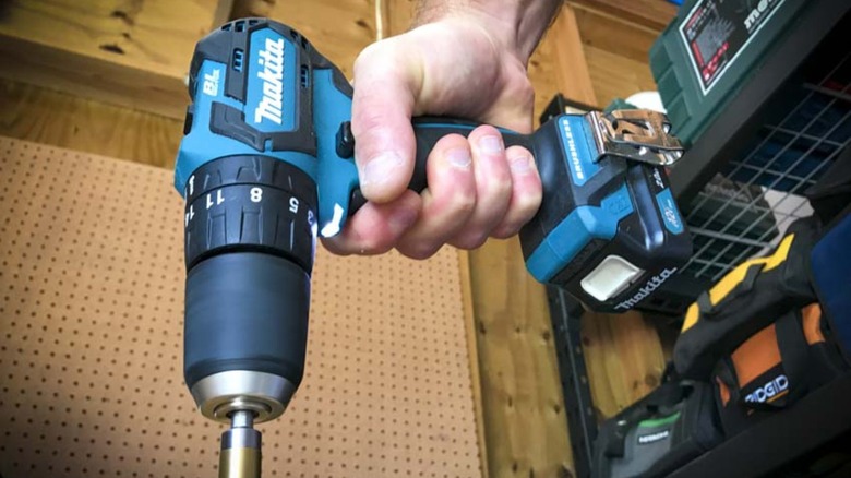 Person using Makita drill