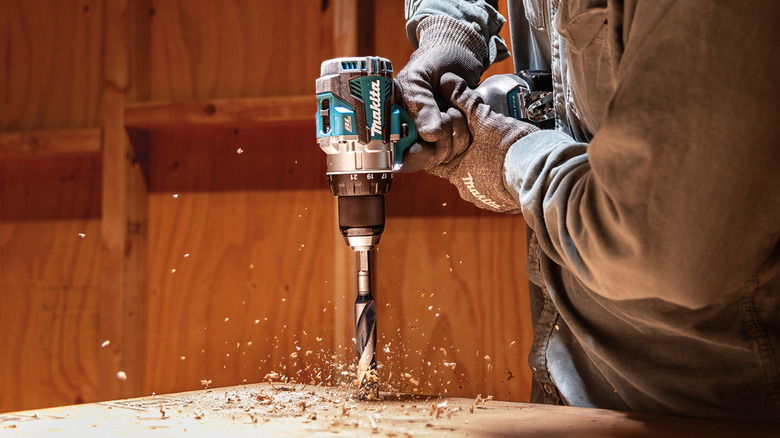 Person using a hammer drill