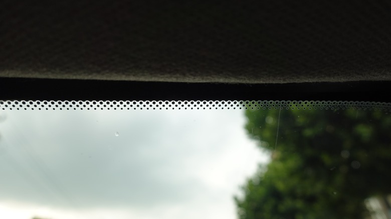 Frit patterns visible on a car's windshield.