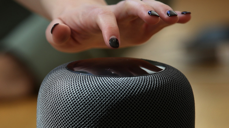 User interacting with a HomePod