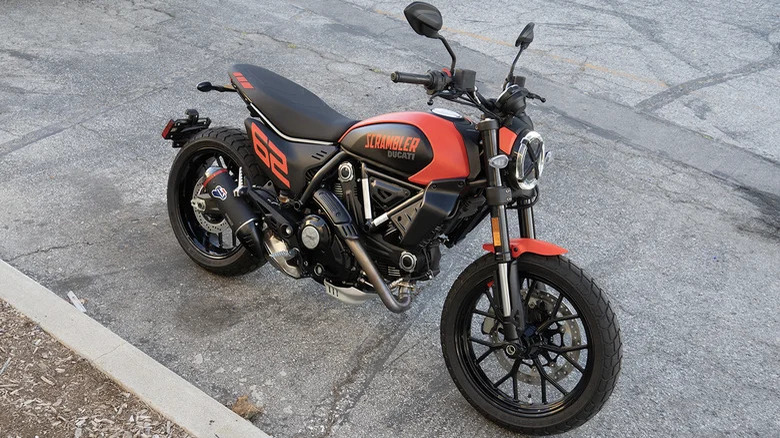 Orange Ducati Scrambler on pavement