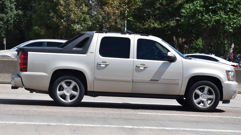 Chevy Avalanche cruising on the street