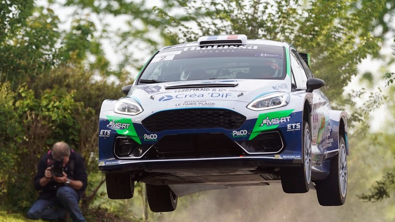 The Ford Fiesta mid-air in a rallycross race