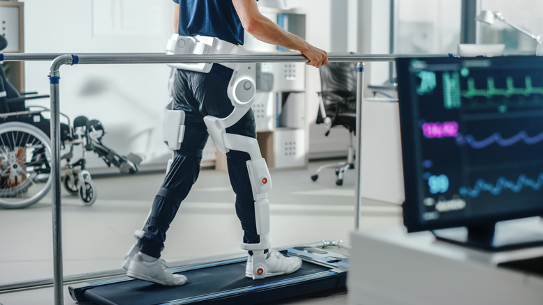 Person walking on treadmill exoskeleton legs