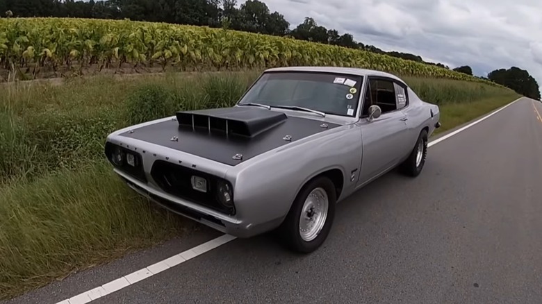Barracuda with 318 V8 on side of road