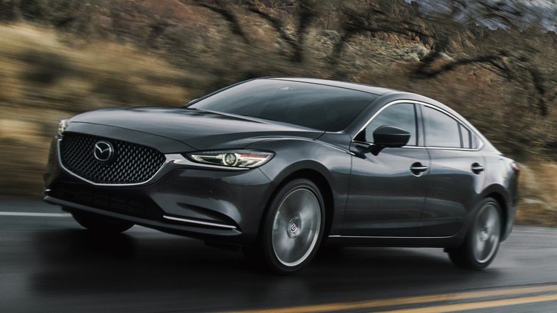 Mazda6 driving on road front quarter