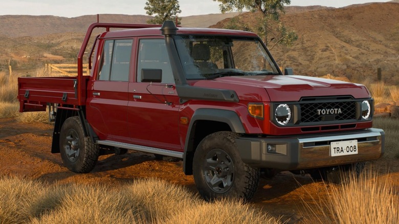 Red Toyota LandCruiser 70 front quarter