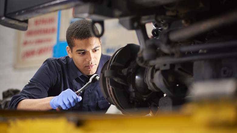 Mechanic works on brake disks