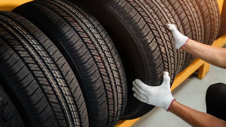 mechanic choosing tires