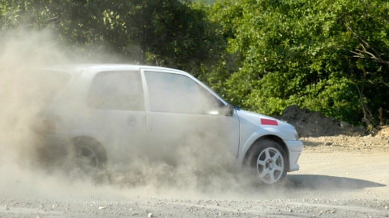 White car stopping after spinning out