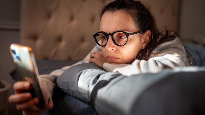 frustrated woman using iphone