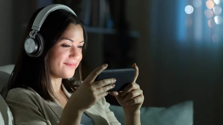 Woman watching movie on phone