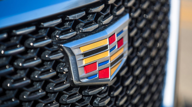 Old Cadillac logo on the front grill of a Cadillac car