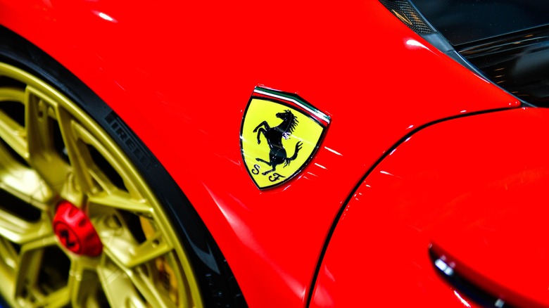 Ferrari logo on the fender of a red Ferrari car