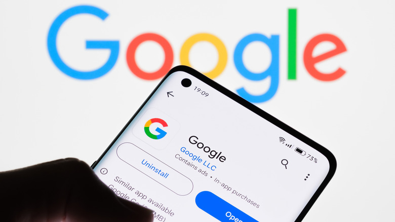 Google logo on a smartphone screen and in the background