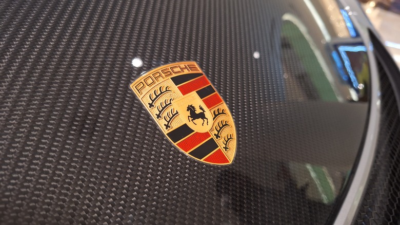 Close up photo of a Porsche emblem