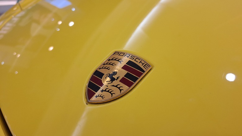 Porsche crest on the hood of a Porsche 911