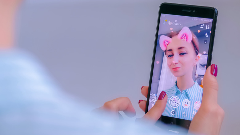 Woman using Snapchat filters