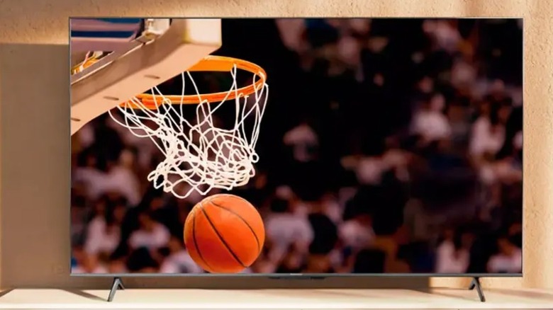 A Hisense U6N series TV with a basketball game on the screen.