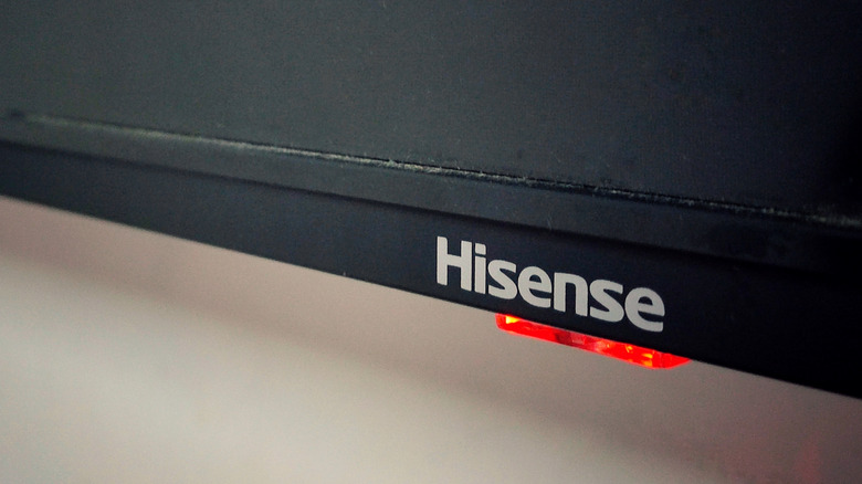 Close up of Hisense TV showing log and red light