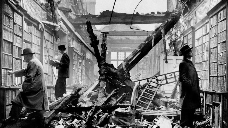 Men inspect the ruined library 