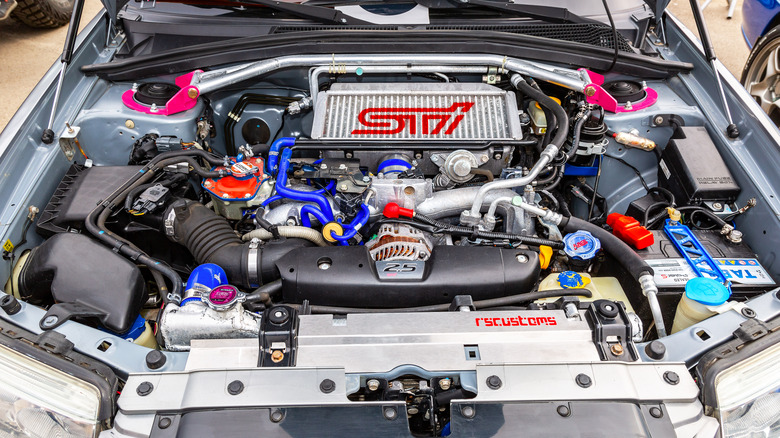 engine bay of souped-up Subaru car