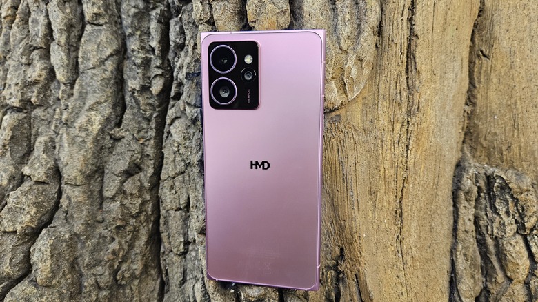 HMD Skyline in neon pink against a tree.