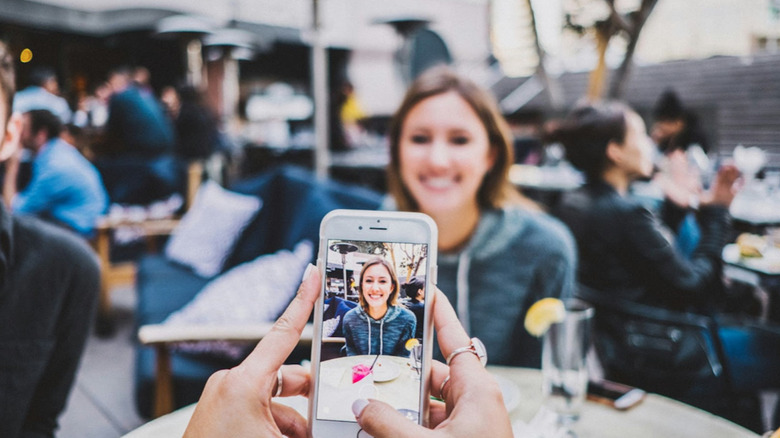 Taking a photo of a woman 