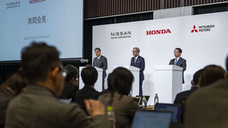 Nissan, Honda, and Mitsubishi reps at press conference