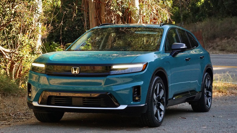 Blue Honda Prologue on street