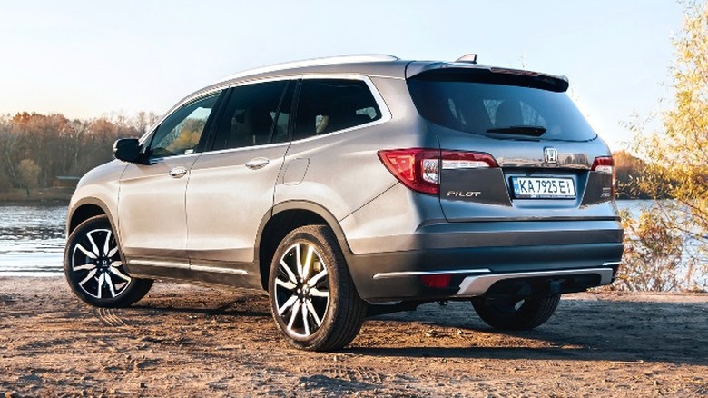 rear view of a Honda Pilot near a river