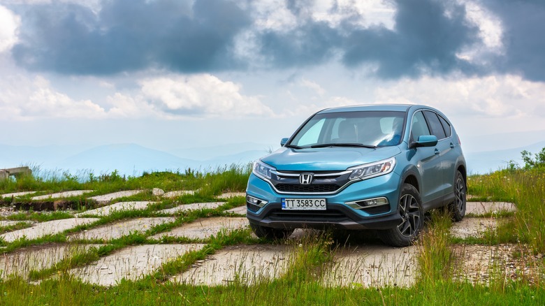 A blue Honda CR-V in the mountains