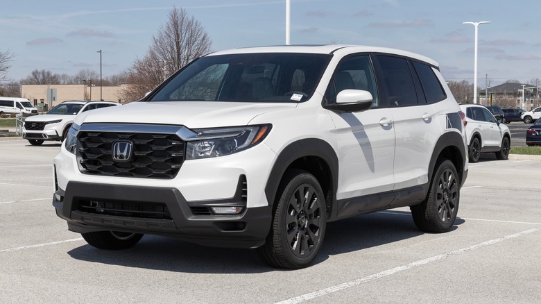 White Honda Passport parked in a parking space