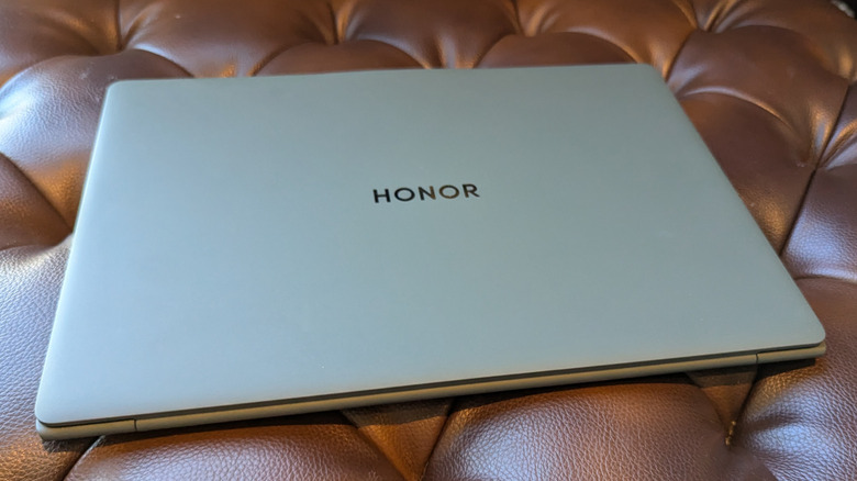 Honor MagicBook 14 on a leather couch