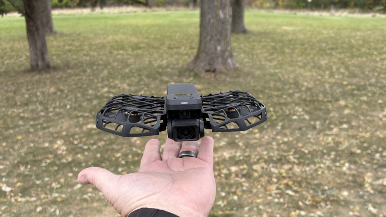 HoverAir X1 ProMax hovering above a hand