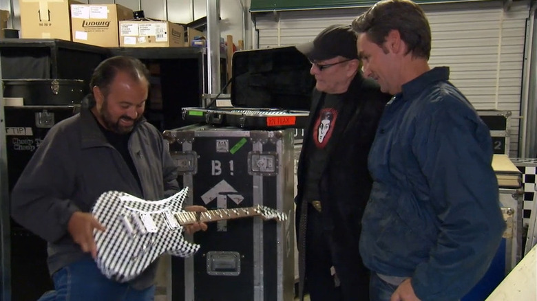 Frank Fritz, Rick Nielsen, Mike Wolfe, and the checkered guitar