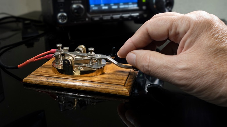 Man using telegraph machine