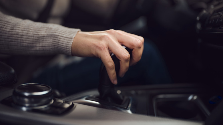 Woman shifting automatic transmission